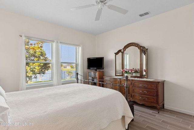 267 Ash Breeze Cv, Saint Augustine, FL 32095 - bedroom featuring baseboards, wood finished floors, and a ceiling fan