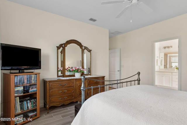 267 Ash Breeze Cv, Saint Augustine, FL 32095 - bedroom featuring wood tiled floors, ensuite bathroom, and a ceiling fan