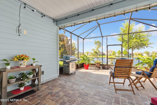 267 Ash Breeze Cv, Saint Augustine, FL 32095 - view of patio with glass enclosure, a water view, and grilling area