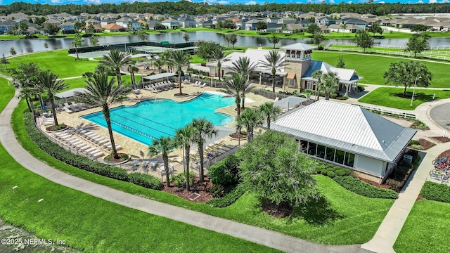 267 Ash Breeze Cv, Saint Augustine, FL 32095 - community pool featuring a residential view, a water view, a lawn, and a patio