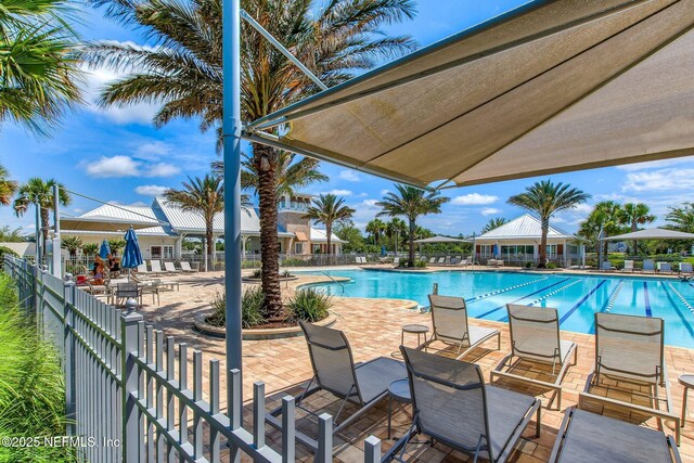 267 Ash Breeze Cv, Saint Augustine, FL 32095 - community pool featuring a patio area