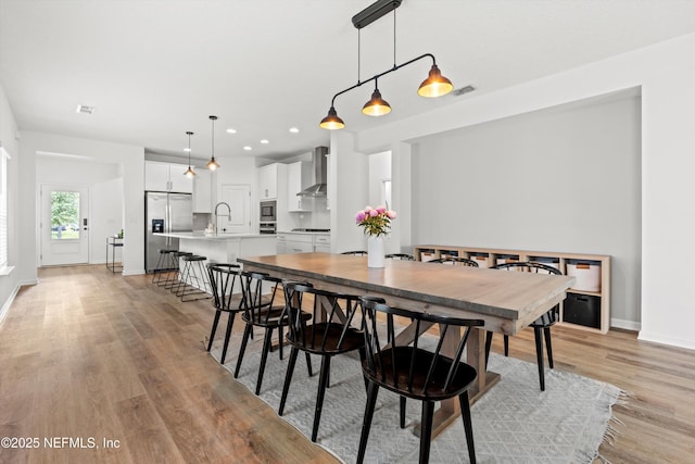 32 Mosaic Park Ave, Saint Augustine, FL 32092 - dining space featuring light wood finished floors, baseboards, and recessed lighting