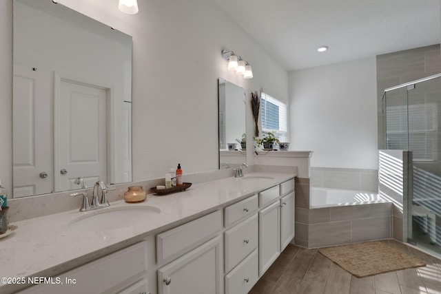 84754 Fall River Pkwy, Fernandina Beach, FL 32034 - bathroom featuring double vanity, a bath, a shower stall, and recessed lighting