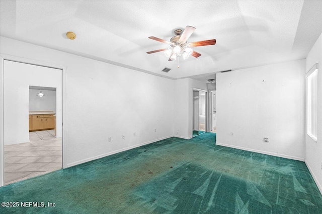 30 Patuxent Ln, Palm Coast, FL 32164 - unfurnished room with a ceiling fan, carpet floors, a smoke detector, a textured ceiling, and baseboards