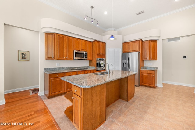 1460 Atlantic Breeze Way, Ponte Vedra Beach, FL 32082 - kitchen featuring appliances with stainless steel finishes, brown cabinets, crown molding, light stone counters, and a sink