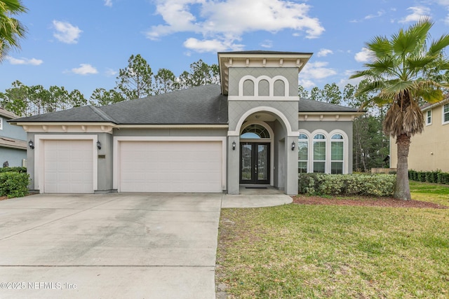 1098 Spanish Bay Ct, Orange Park, FL 32065 - view of front of house with french doors, an attached garage, concrete driveway, and roof with shingles