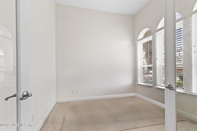 1098 Spanish Bay Ct, Orange Park, FL 32065 - carpeted empty room with baseboards and french doors