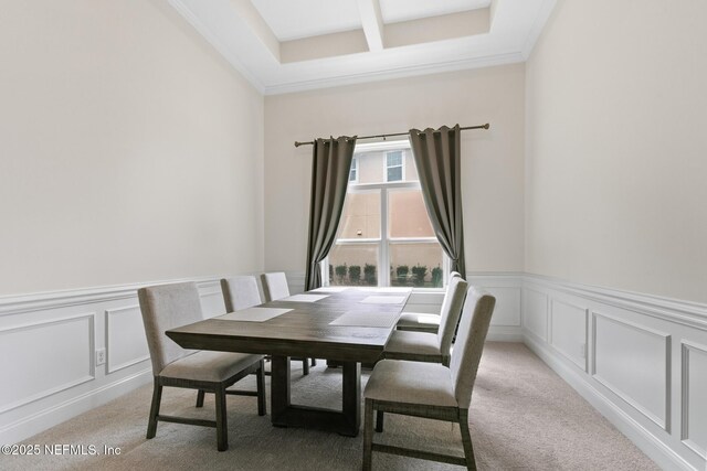 1098 Spanish Bay Ct, Orange Park, FL 32065 - dining space featuring a decorative wall, light colored carpet, wainscoting, coffered ceiling, and beamed ceiling