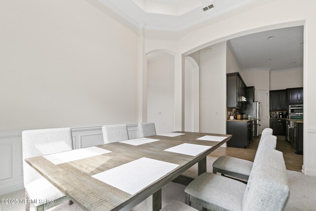 1098 Spanish Bay Ct, Orange Park, FL 32065 - dining room featuring arched walkways and ornamental molding
