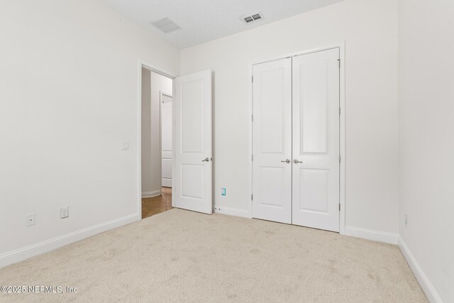 1098 Spanish Bay Ct, Orange Park, FL 32065 - unfurnished bedroom with carpet, baseboards, and a closet