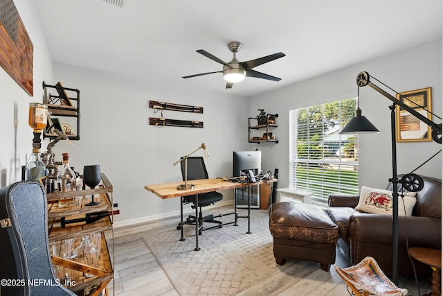 12489 Windy Willows Dr N, Jacksonville, FL 32225 - office area featuring ceiling fan, wood finished floors, and baseboards