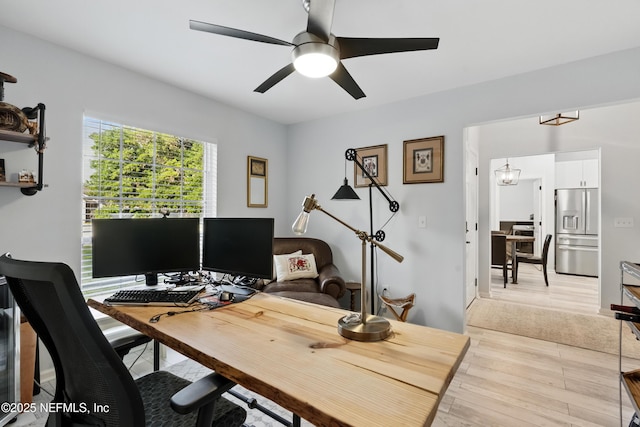12489 Windy Willows Dr N, Jacksonville, FL 32225 - office featuring ceiling fan, light wood-type flooring, and a chandelier