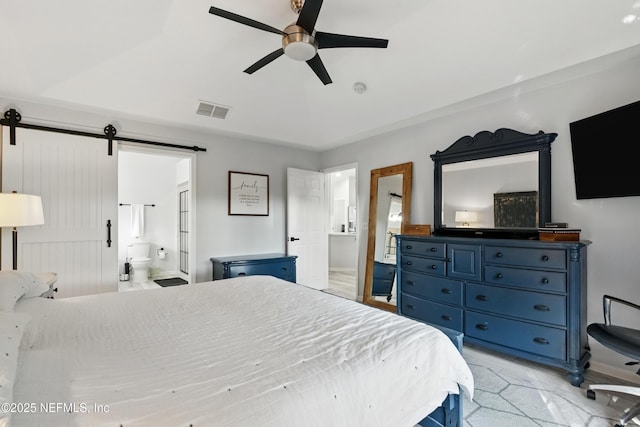 12489 Windy Willows Dr N, Jacksonville, FL 32225 - bedroom featuring a barn door, connected bathroom, and ceiling fan