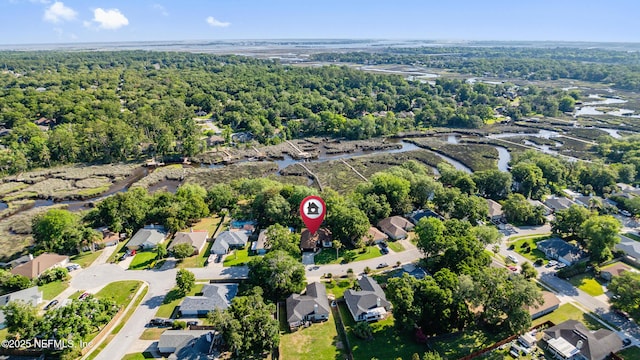 12489 Windy Willows Dr N, Jacksonville, FL 32225 - aerial overview of property's location with nearby suburban area and a heavily wooded area