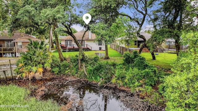 12489 Windy Willows Dr N, Jacksonville, FL 32225 - view of yard with a wooden deck