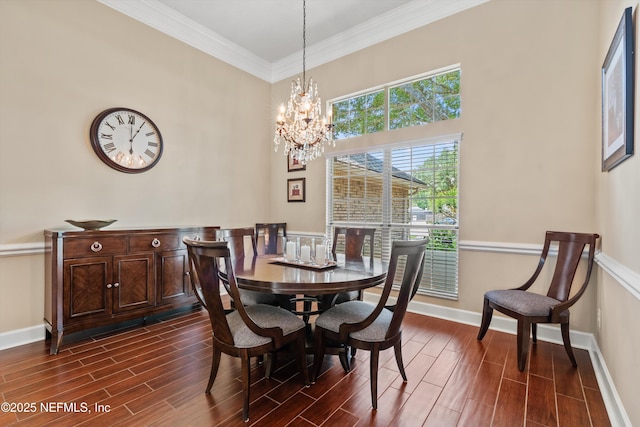 595 Glasgow Ct, Orange Park, FL 32073 - dining space with wood tiled floors, baseboards, a chandelier, crown molding, and a high ceiling