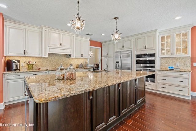 595 Glasgow Ct, Orange Park, FL 32073 - kitchen featuring stainless steel appliances, a sink, a chandelier, dark wood-type flooring, and recessed lighting