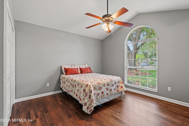 595 Glasgow Ct, Orange Park, FL 32073 - bedroom with lofted ceiling, wood finished floors, baseboards, and a ceiling fan