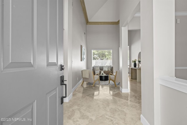 13759 Wingfield Pl, Jacksonville, FL 32224 - entryway featuring baseboards, a high ceiling, light marble finish flooring, and ornamental molding