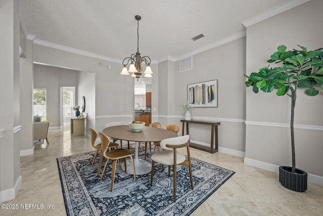 13759 Wingfield Pl, Jacksonville, FL 32224 - dining space with crown molding, baseboards, and a chandelier