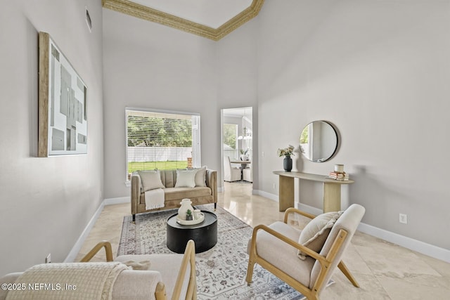 13759 Wingfield Pl, Jacksonville, FL 32224 - living room featuring baseboards, crown molding, and a towering ceiling