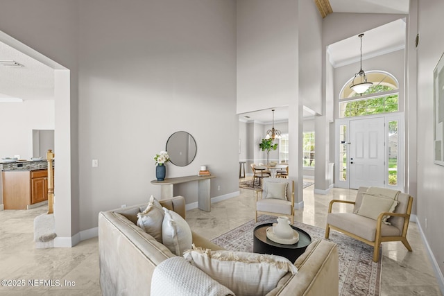 13759 Wingfield Pl, Jacksonville, FL 32224 - living area with a high ceiling, light marble finish floors, and baseboards