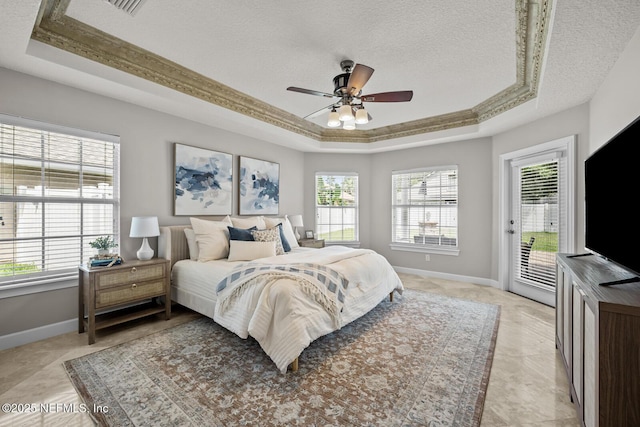 13759 Wingfield Pl, Jacksonville, FL 32224 - bedroom with a tray ceiling, access to exterior, baseboards, a textured ceiling, and a ceiling fan