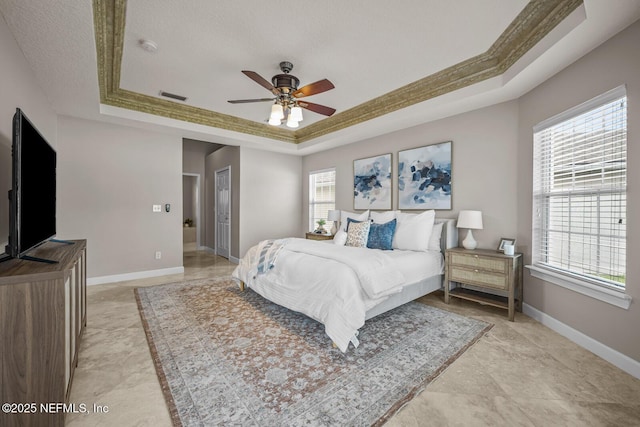 13759 Wingfield Pl, Jacksonville, FL 32224 - bedroom with a tray ceiling, baseboards, and a ceiling fan