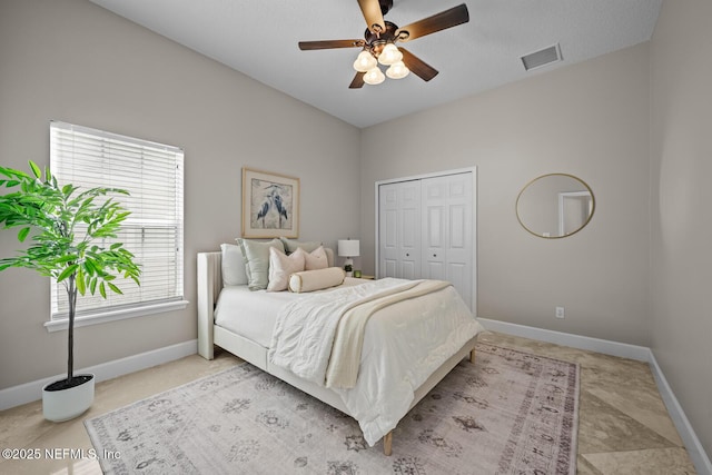 13759 Wingfield Pl, Jacksonville, FL 32224 - bedroom with baseboards, a closet, and a ceiling fan