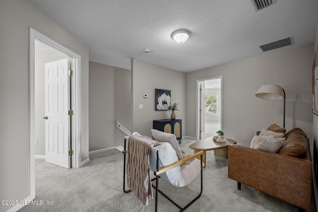 13759 Wingfield Pl, Jacksonville, FL 32224 - carpeted living area featuring a textured ceiling and baseboards