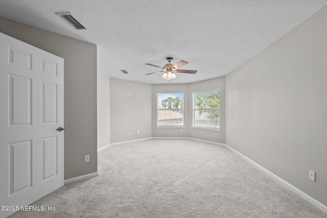 13759 Wingfield Pl, Jacksonville, FL 32224 - carpeted spare room featuring a ceiling fan, baseboards, and a textured ceiling