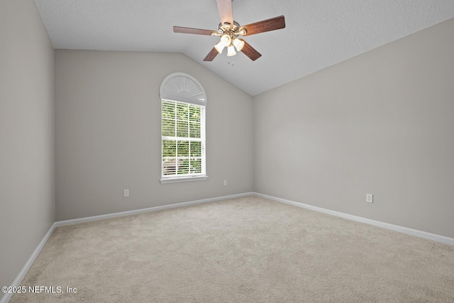 13759 Wingfield Pl, Jacksonville, FL 32224 - unfurnished room with carpet, a ceiling fan, baseboards, vaulted ceiling, and a textured ceiling