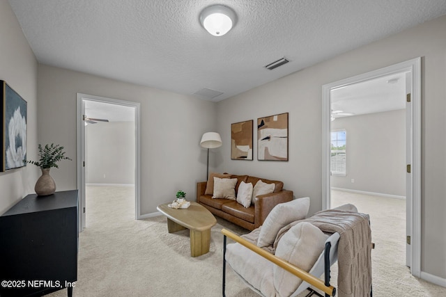 13759 Wingfield Pl, Jacksonville, FL 32224 - living area featuring light carpet, a textured ceiling, and baseboards