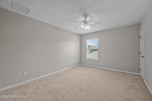 13759 Wingfield Pl, Jacksonville, FL 32224 - unfurnished room with a textured ceiling, baseboards, carpet, ceiling fan, and attic access
