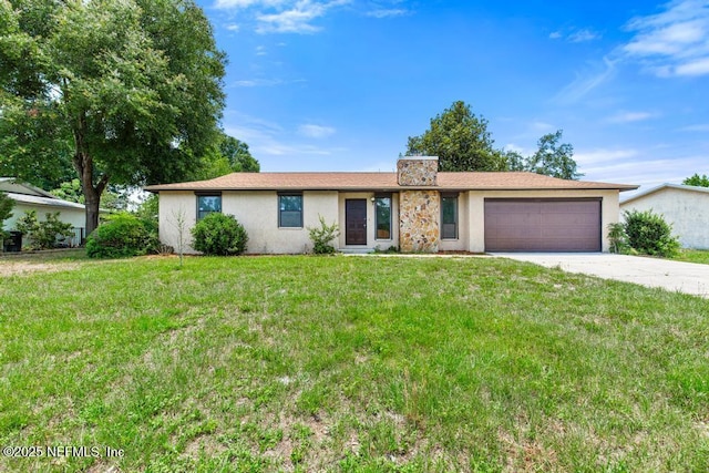 1169 Tumbleweed Dr, Orange Park, FL 32065 - view of front of home featuring stucco siding, a garage, concrete driveway, a front lawn, and a chimney