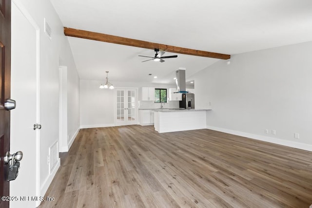 1169 Tumbleweed Dr, Orange Park, FL 32065 - unfurnished living room with a ceiling fan, light wood-style floors, baseboards, french doors, and recessed lighting