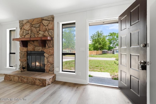 1169 Tumbleweed Dr, Orange Park, FL 32065 - foyer entrance featuring ornamental molding, wood finished floors, and a fireplace