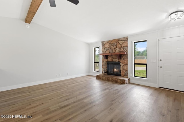 1169 Tumbleweed Dr, Orange Park, FL 32065 - unfurnished living room featuring wood finished floors, baseboards, a fireplace, and a ceiling fan