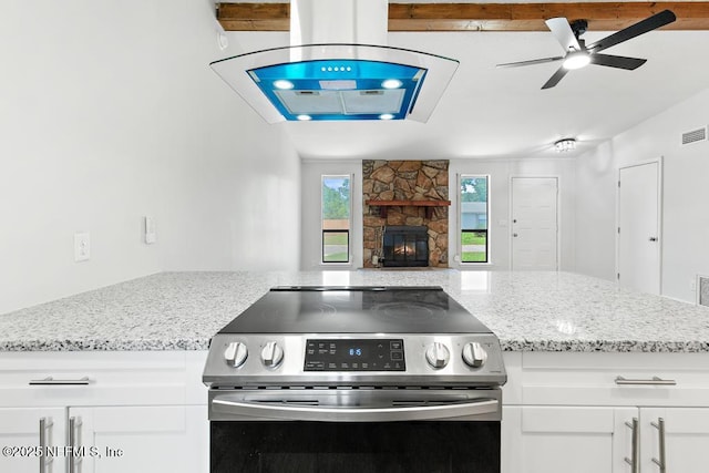 1169 Tumbleweed Dr, Orange Park, FL 32065 - kitchen featuring stainless steel electric stove, light stone countertops, white cabinets, a ceiling fan, and open floor plan