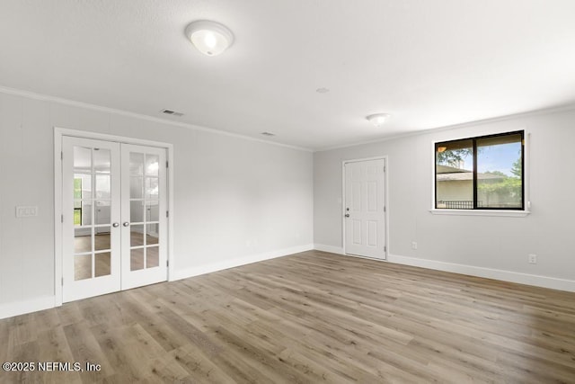 1169 Tumbleweed Dr, Orange Park, FL 32065 - unfurnished room with french doors, crown molding, wood finished floors, and baseboards