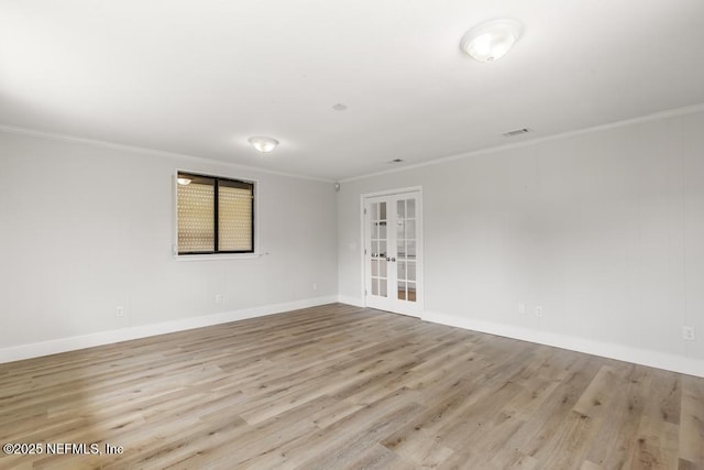 1169 Tumbleweed Dr, Orange Park, FL 32065 - spare room with french doors, wood finished floors, ornamental molding, and baseboards