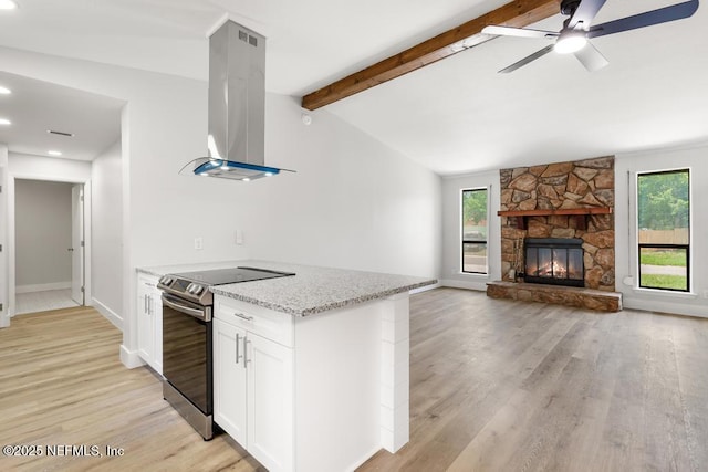 1169 Tumbleweed Dr, Orange Park, FL 32065 - kitchen featuring electric stove, island exhaust hood, plenty of natural light, light stone countertops, and recessed lighting