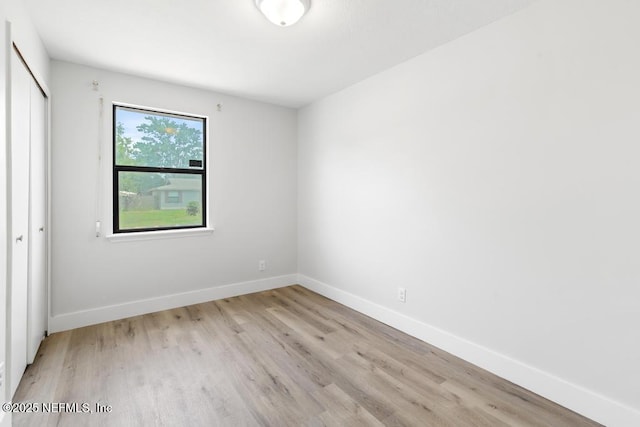 1169 Tumbleweed Dr, Orange Park, FL 32065 - unfurnished bedroom with a closet, light wood finished floors, and baseboards