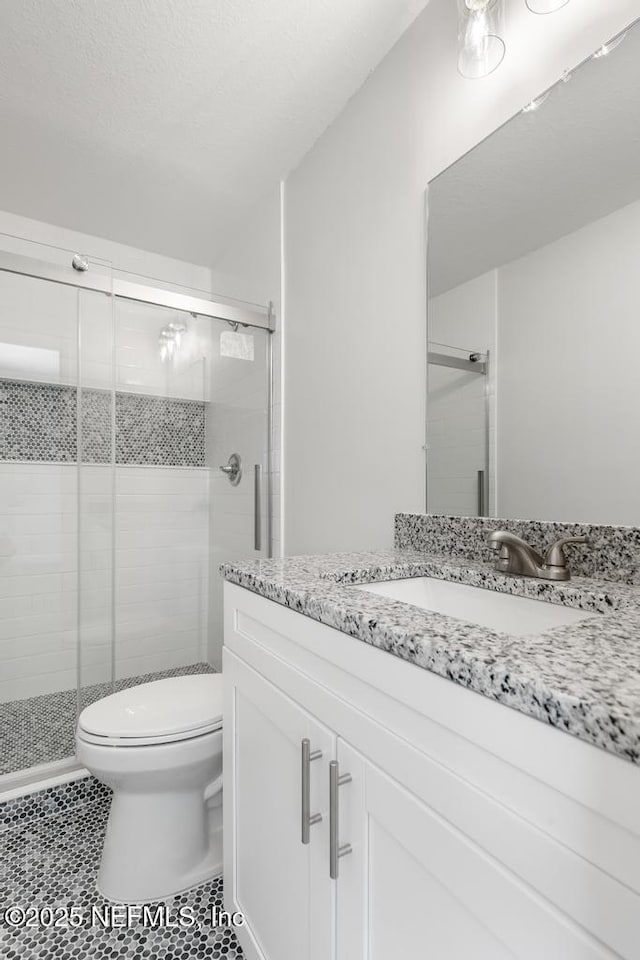 1169 Tumbleweed Dr, Orange Park, FL 32065 - full bathroom with toilet, a shower stall, vanity, and tile patterned floors