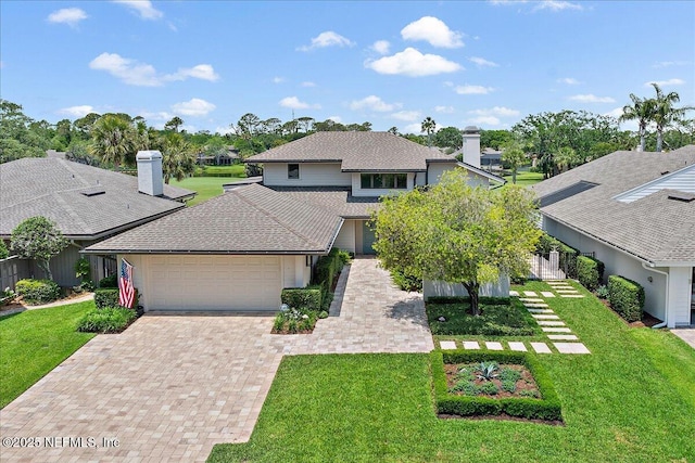 57 Village Walk Dr, Ponte Vedra Beach, FL 32082 - view of front of property with a garage, a chimney, and decorative driveway