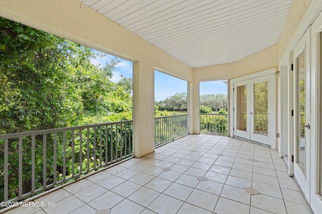 100 Bermuda Bay Cir Unit 104, Ponte Vedra Beach, FL 32082 - unfurnished sunroom with french doors and tile patterned flooring