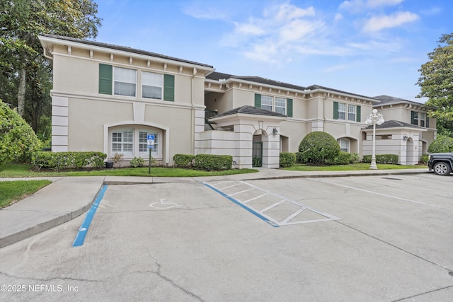 100 Bermuda Bay Cir Unit 104, Ponte Vedra Beach, FL 32082 - view of property featuring uncovered parking