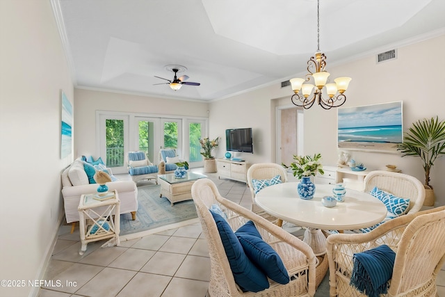 100 Bermuda Bay Cir Unit 104, Ponte Vedra Beach, FL 32082 - dining area with a tray ceiling, light tile patterned flooring, a chandelier, crown molding, and ceiling fan