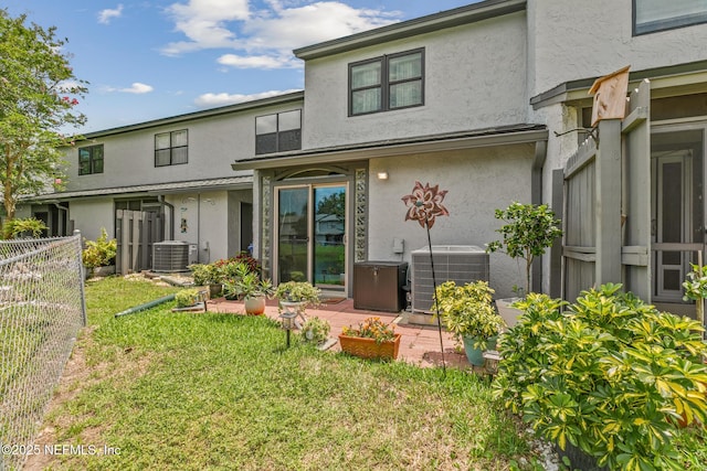 15 Ponte Vedra Ct Unit C, Ponte Vedra Beach, FL 32082 - back of house with stucco siding and central AC