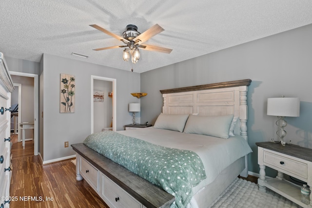 15 Ponte Vedra Ct Unit C, Ponte Vedra Beach, FL 32082 - bedroom with baseboards, dark wood-style flooring, a textured ceiling, and a ceiling fan